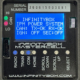Close-up of the Infinitybox MASTERCELL NGX with the cover removed, showing the inSIGHT LCD screen displaying CAN and ignition status, CAN HI/LO indicator lights, serial number, output fuse, and menu navigation buttons.